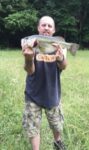 Ike Bowley of Parsons, W.Va. with a 25 inch largemouth bass which weighed 8.5 pounds and was caught at a farm pond in Tucker County. He says it was his biggest bass ever. 
