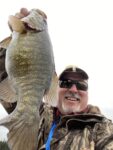 Matthew Pfohl of South Charleston, W.Va. shows off a 20+ inch smallmouth caught on a remote lake in Northern Ontario. 
