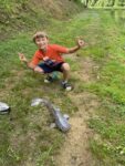 Isaiah Cochran, age 7, from Frazier's Bottom, W.Va. with is first catfish. 
