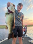 Jaxson Lusk, age 12, of Man, W.Va.  with a 9.5lb 27 inch  Lake Toho, FL trophy largemouth bass caught while vacationing with his family in August 2023.