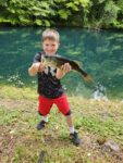 Cruz Mergenthaler of Morgantown with a big bass caught from a family pond which he released after this quick picture. 
