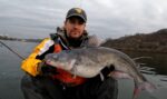 Jason Coleman  of Wheeling, W.Va. shows off a big blue catfish caught just north of Wheeling on the Ohio River. 
