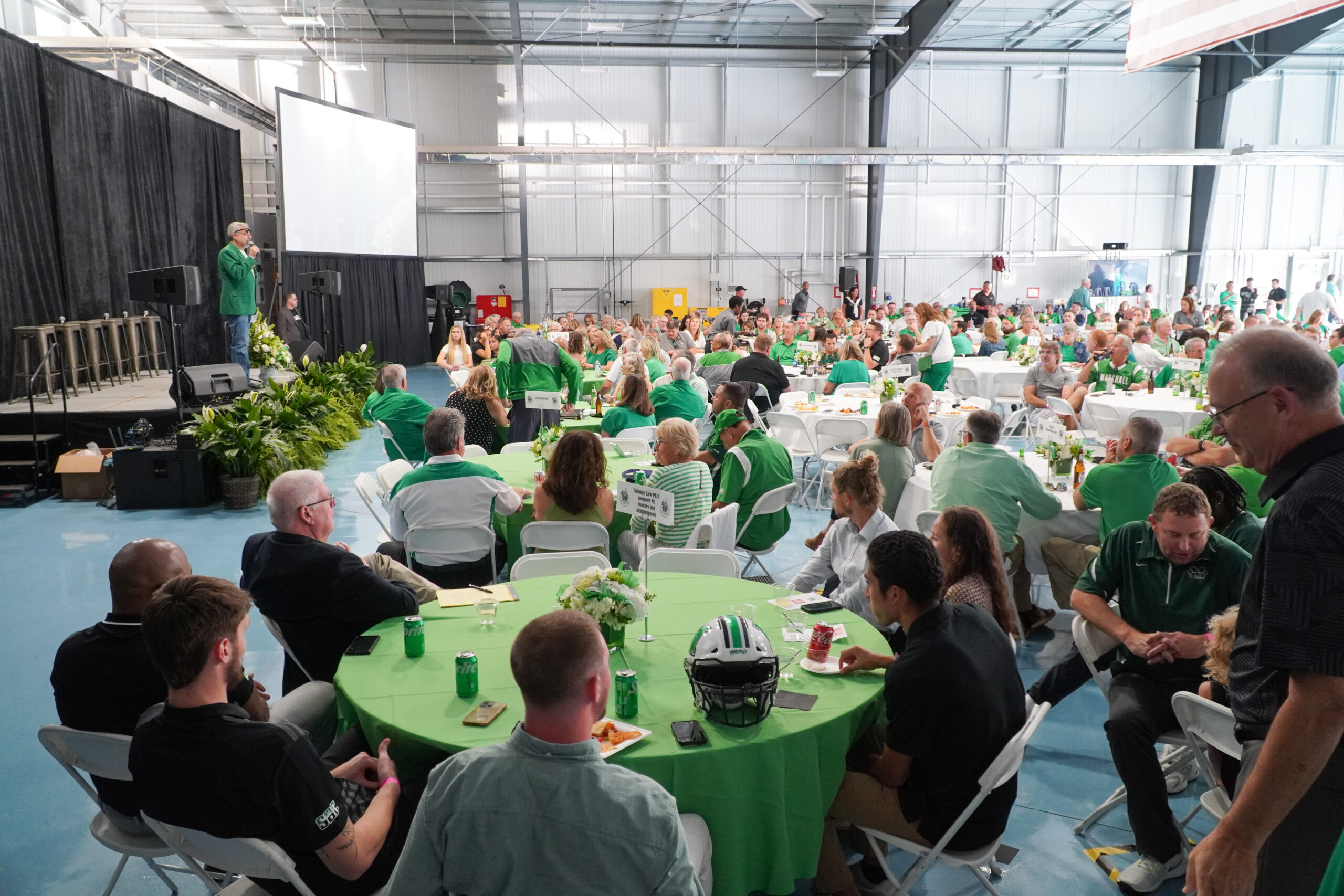 Marshall hosts a fundraiser called “Paint the Capital Green” at the Bill Noe Flight School before the football season